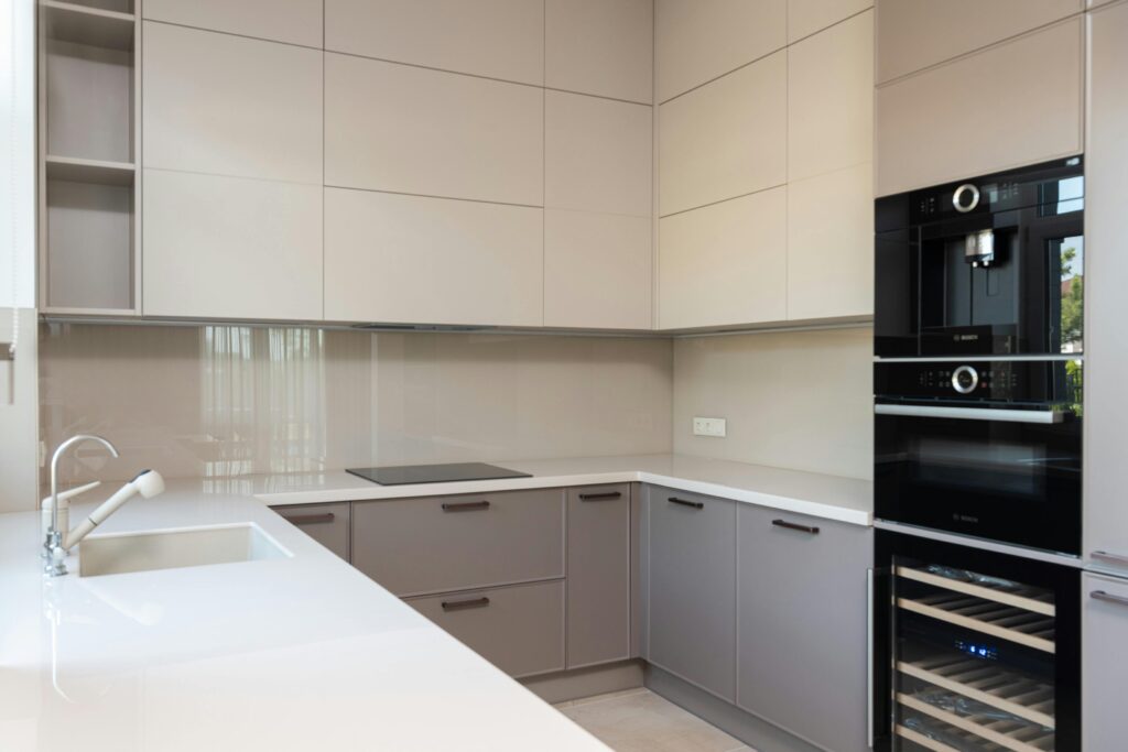 A newly renovated spotless modern kitchen shines after thorough post-renovation cleaning.