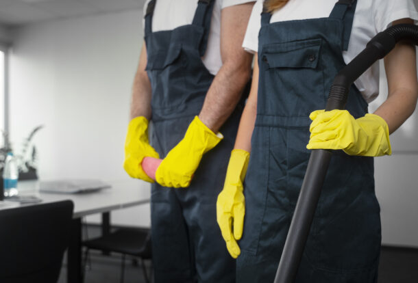 Professional cleaners ready to perform end of tenancy cleaning with professional cleaning equipment.